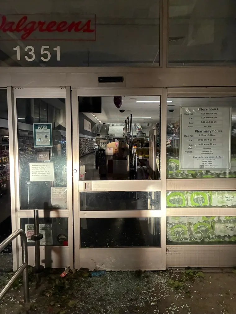 Shattered commercial glass door before the emergency board-up