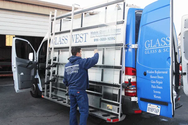 Glass West technician loading glass onto a mobile service van