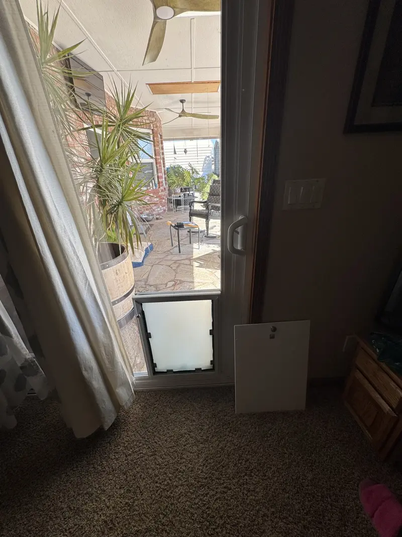 Sliding door pet door with the security panel removed