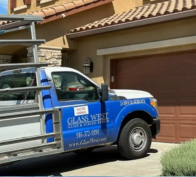 Construction worker installing new window in house