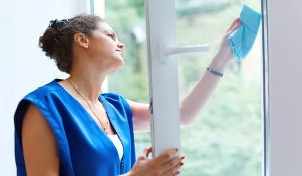 a woman cleaning windows