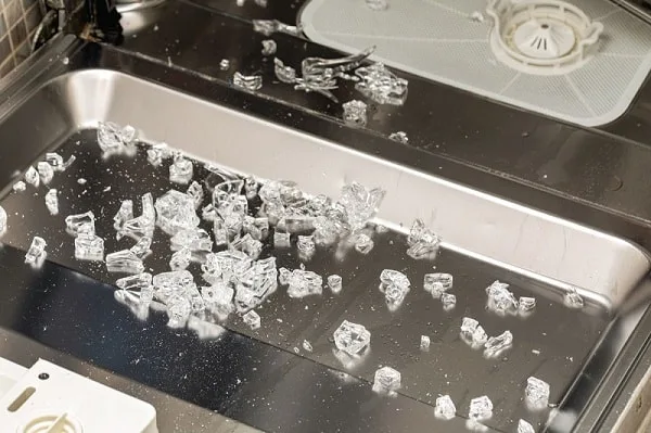 clean broken glass out of a dishwasher
